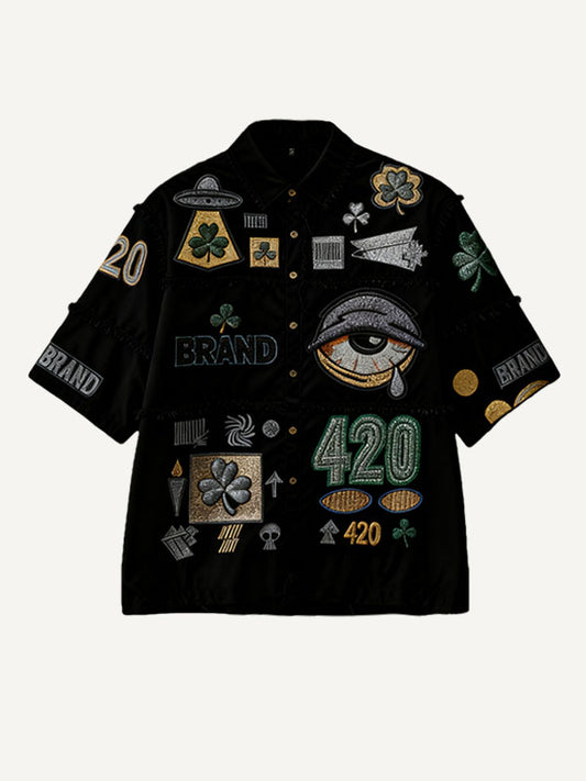 Stylish Christmas seasonal short-sleeved shirt with a patchwork print of various patterns